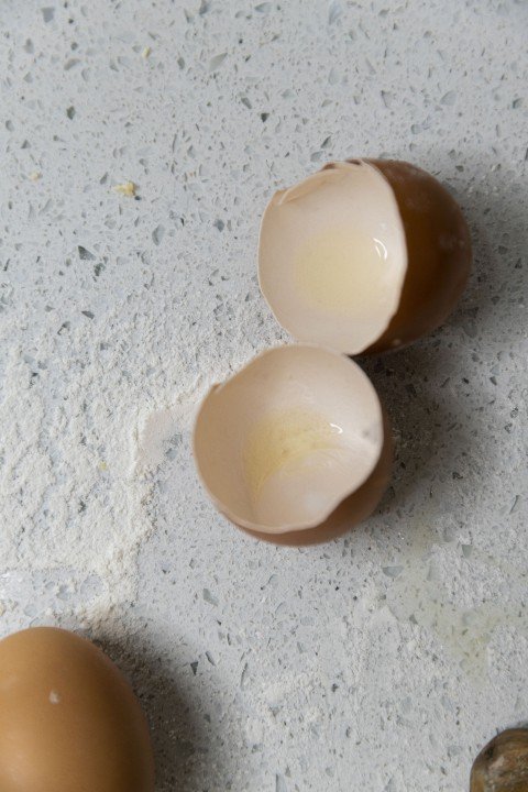 Egg shells on a table with flour