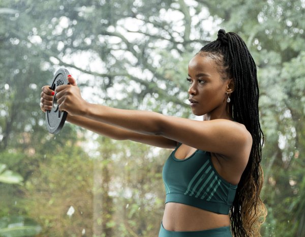 Holding up dumbell at gym
