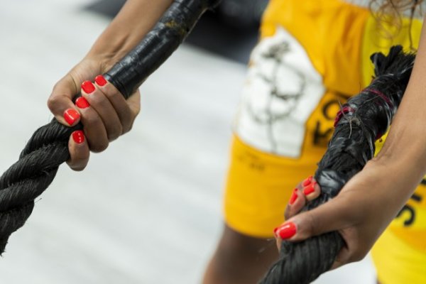 Rope training at the gym with red nails
