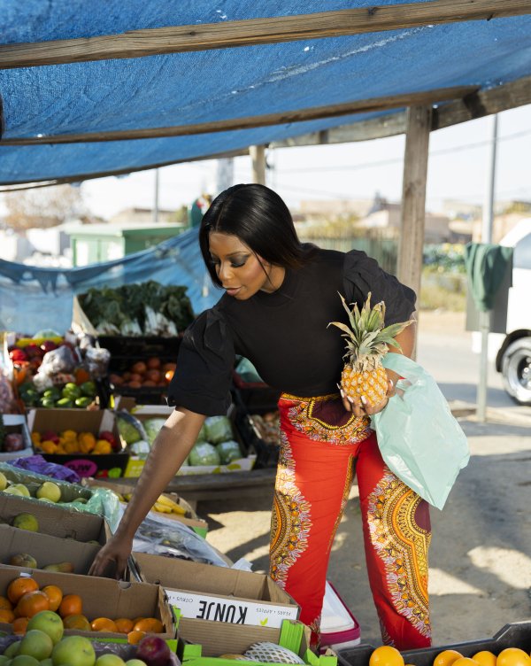 Black woman buying fruits