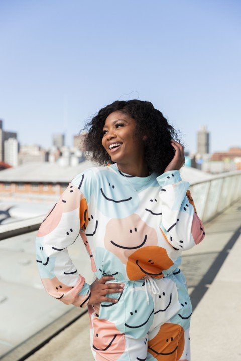 Black woman in the city smiling