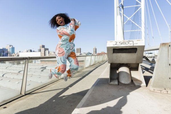 Black woman jumping for joy