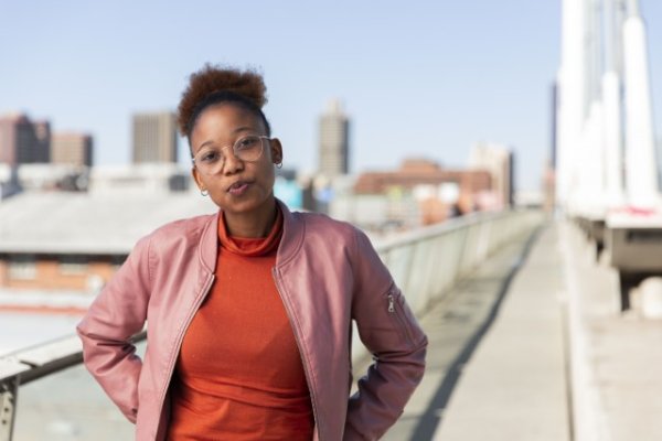 Black woman on Nelson Mandela bridge posing at camera
