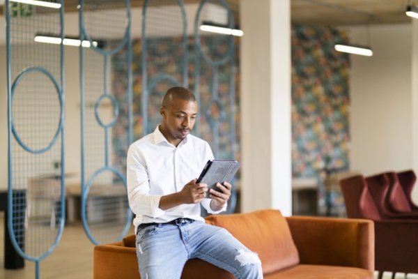 Black man looking at ipad