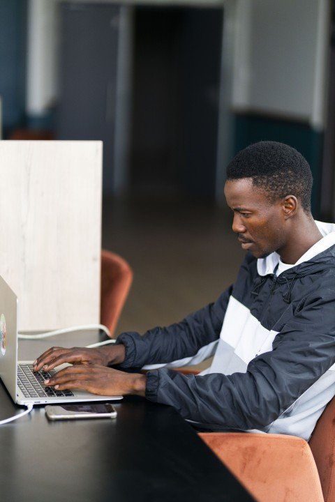 Black man working on the laptop