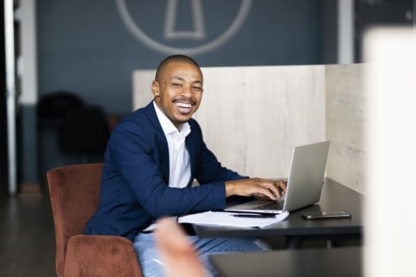 Black business man working from his desk at the office