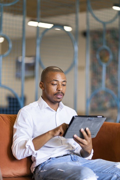 Black business man at working on ipad