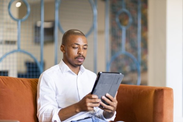 Black business man working on ipad