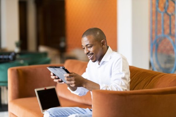 Black man working on ipad