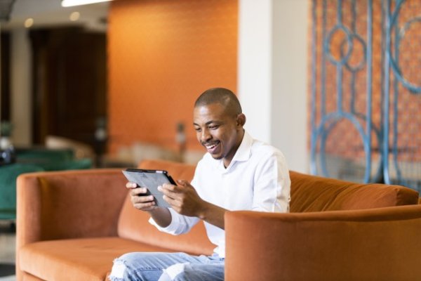 Black man working on ipad