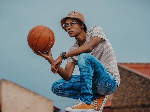 Black Man Holding A Basketball