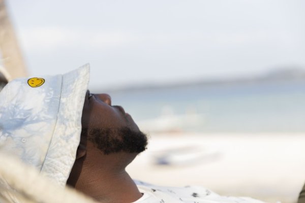 Black man with beard looking up