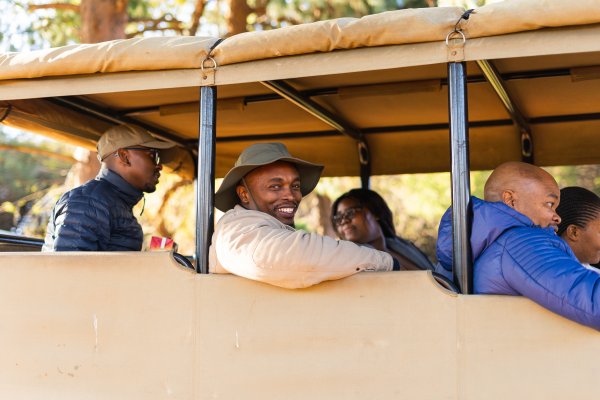 Black people going for a game drive in sunny South Africa
