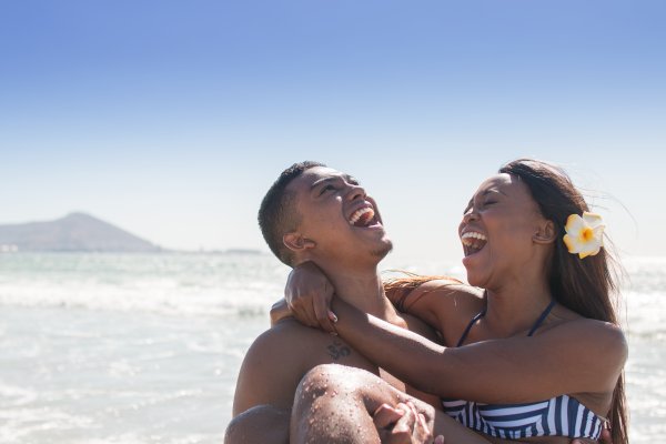 Couple laughing at the beach