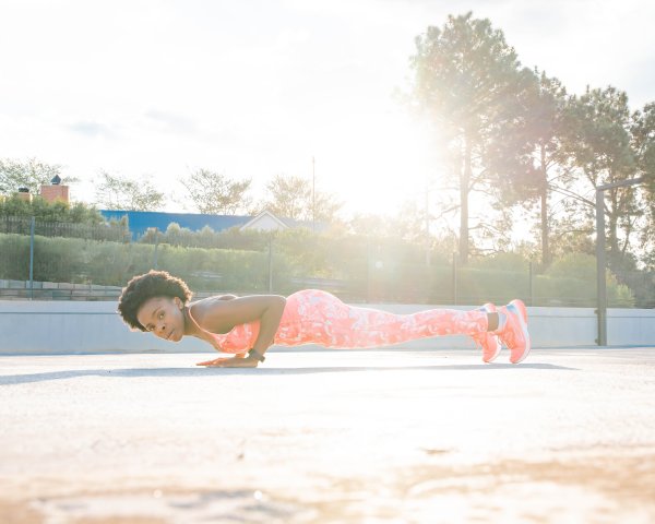 Black athlete doing push-up