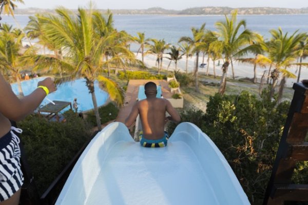 Going down a water slide in Mozambique.