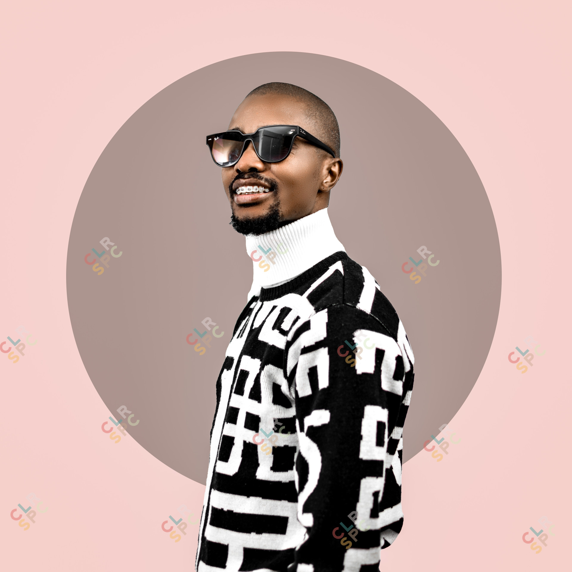 Black man wearing glasses in a studio