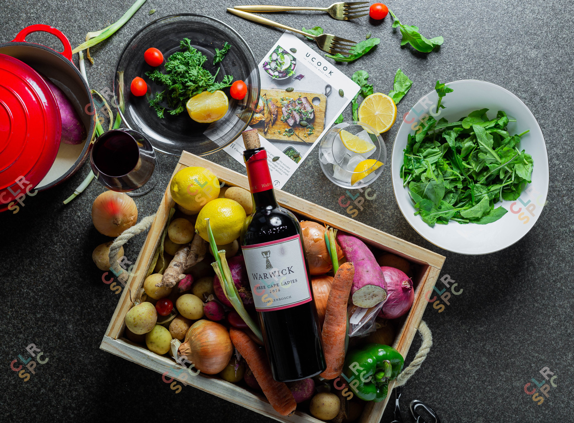 flatlay of vegetables on a table with wine