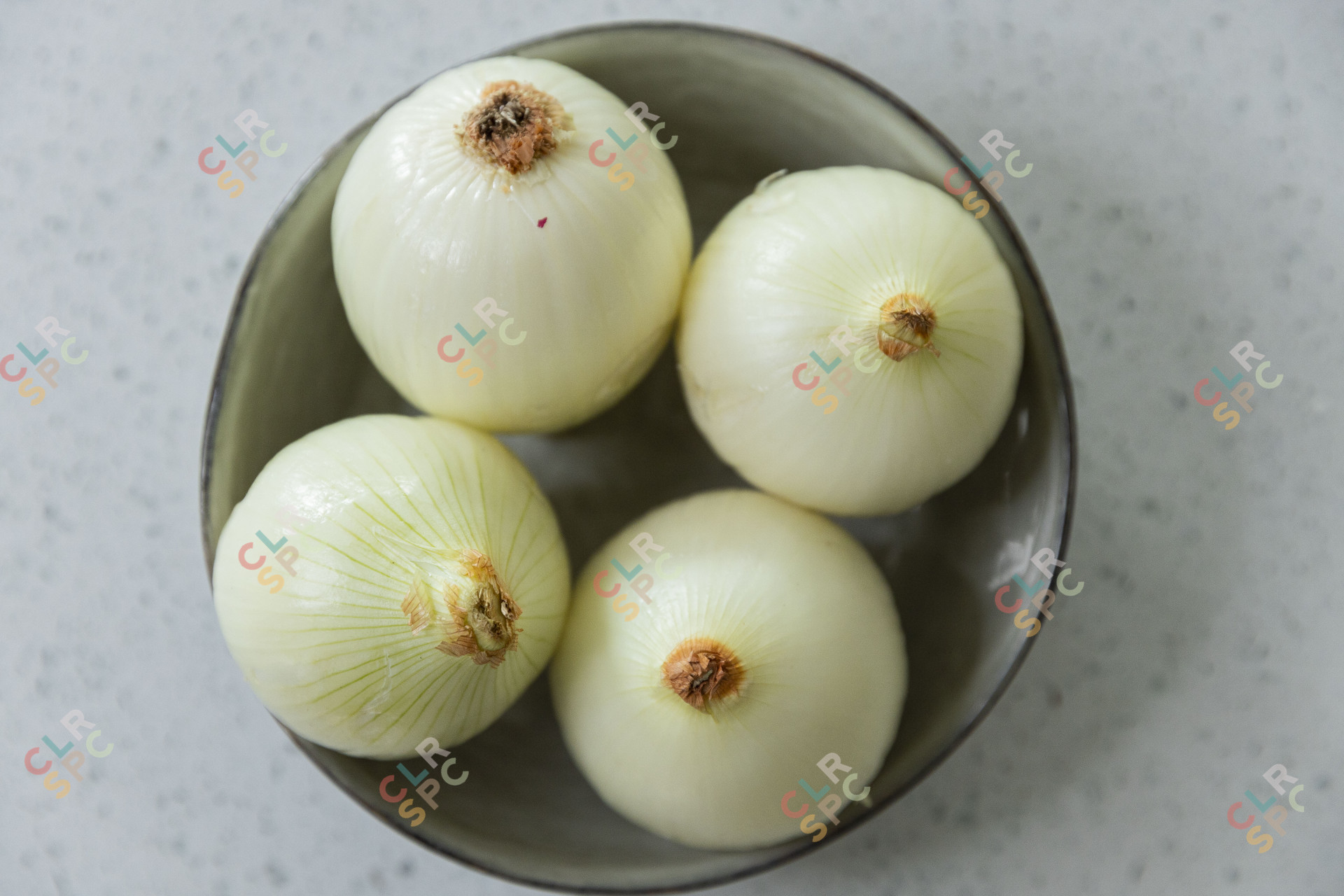 Pealed onions in a bowl