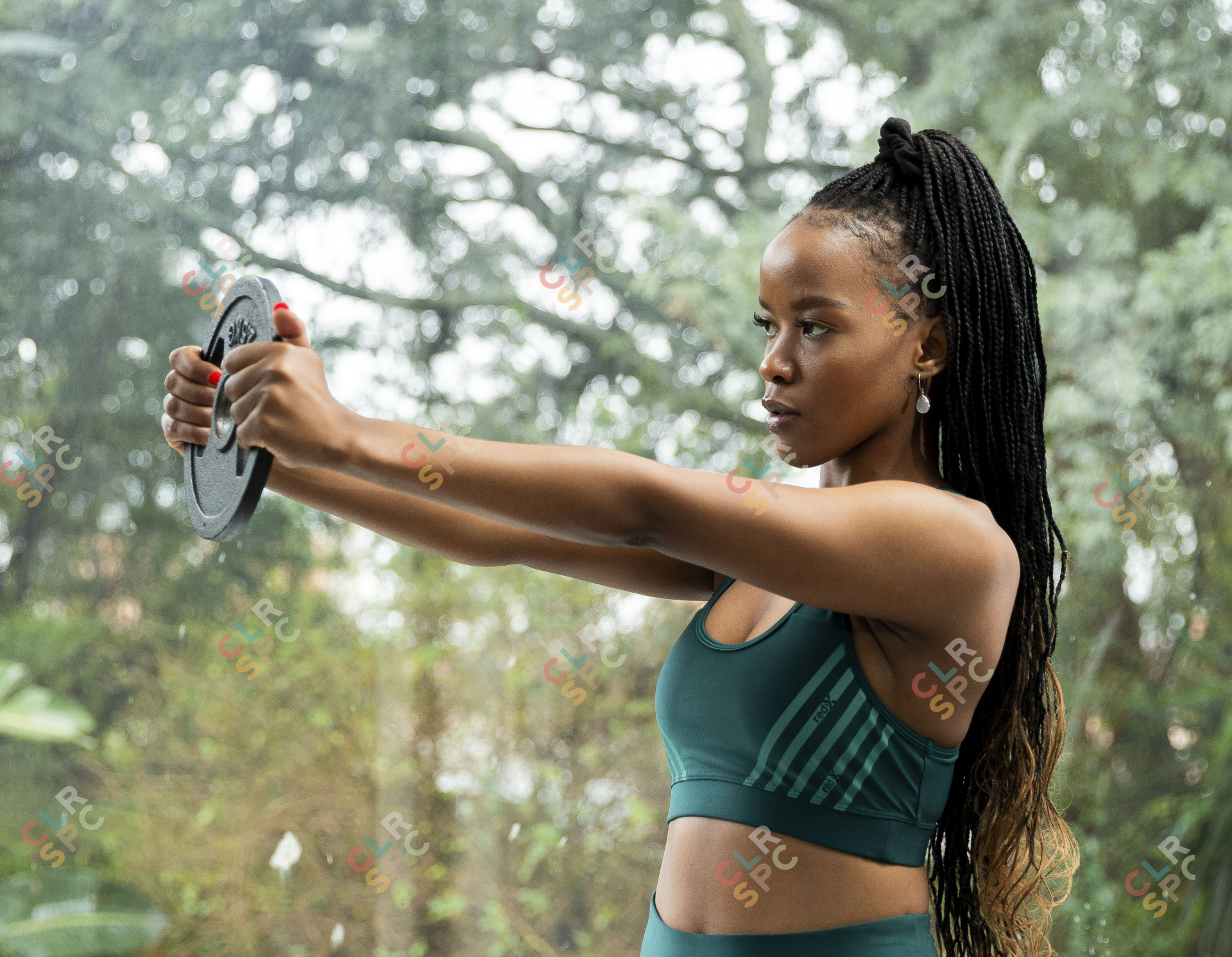 Holding up dumbell at gym