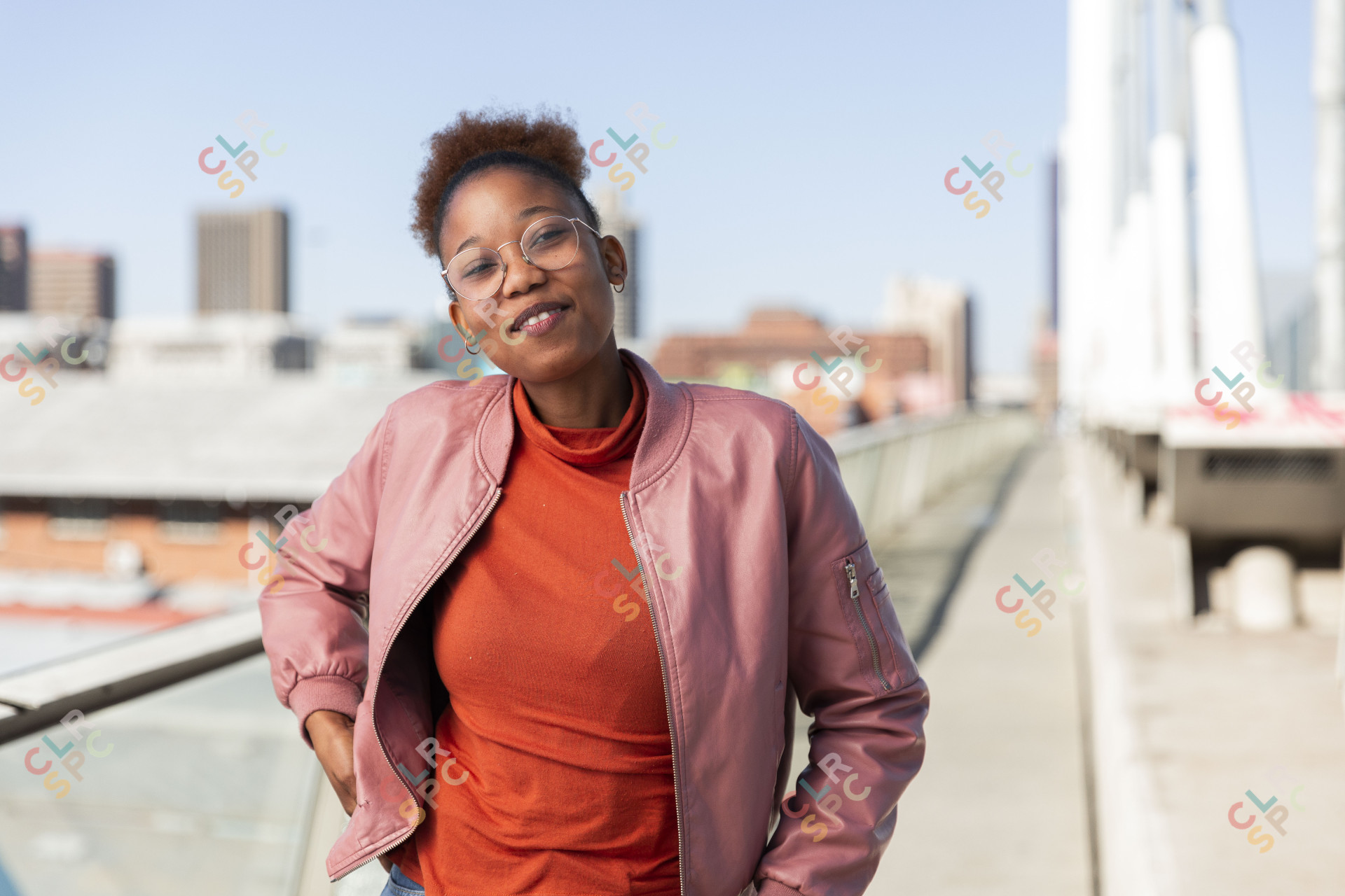 Black woman on Nelson Mandela bridge smiling
