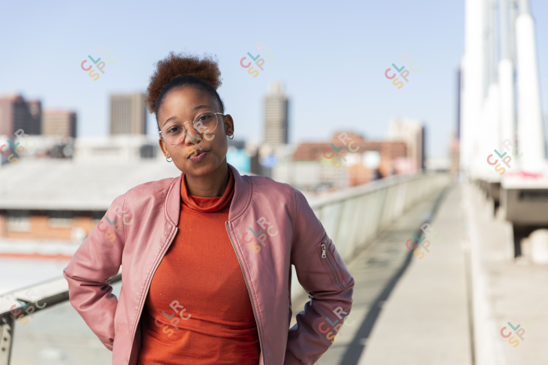 Black woman on Nelson Mandela bridge posing at camera