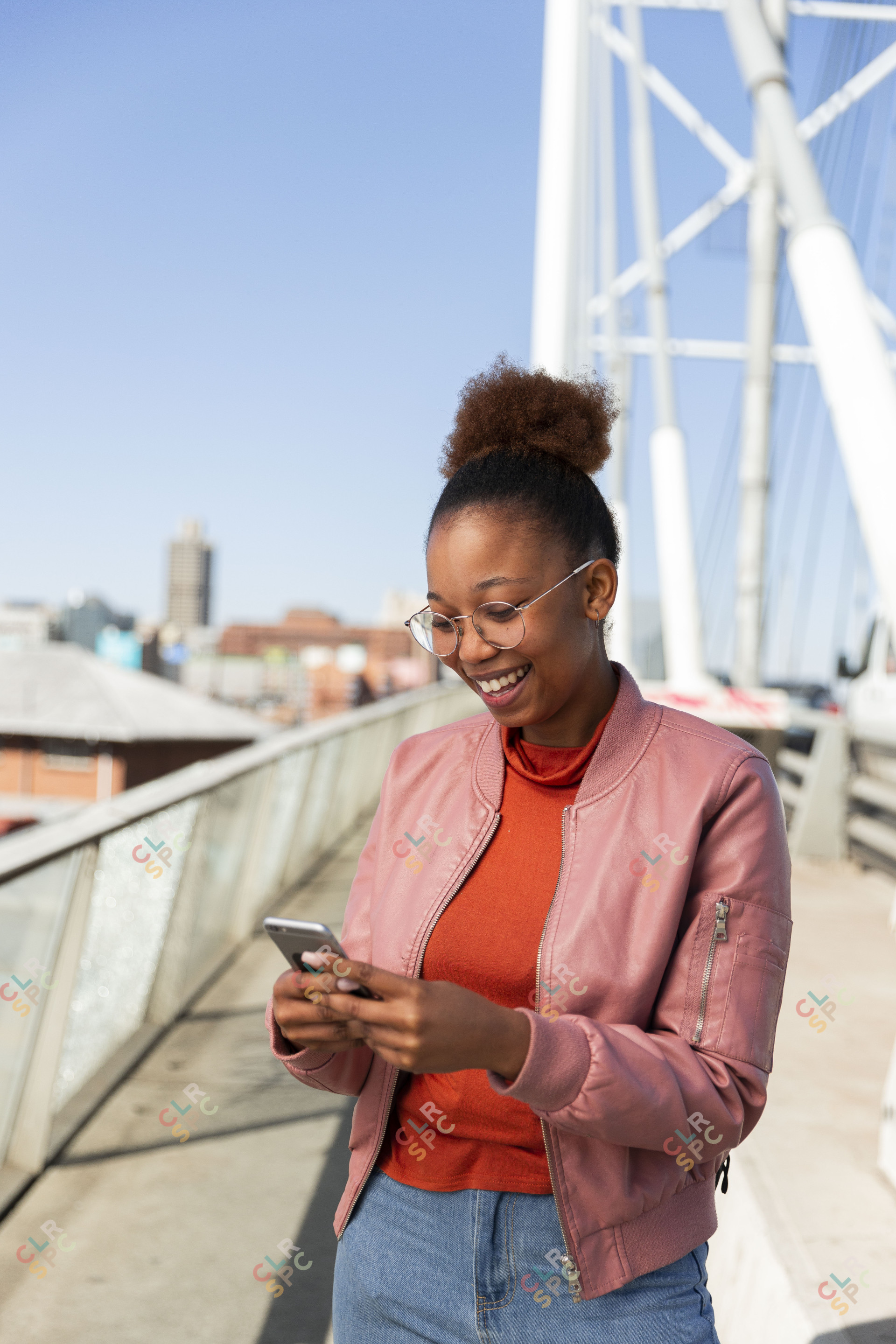 Black woman on Nelson Mandela bridge on cellphone