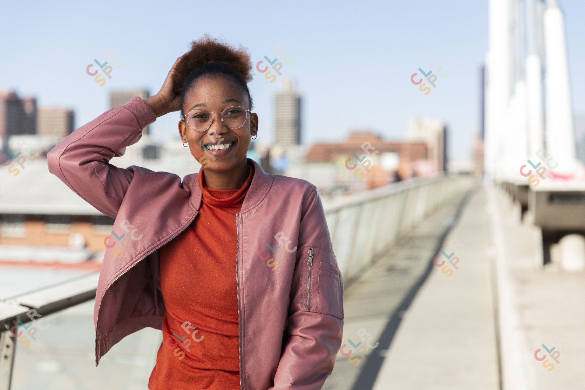 Black woman on Nelson Mandela bridge smiling