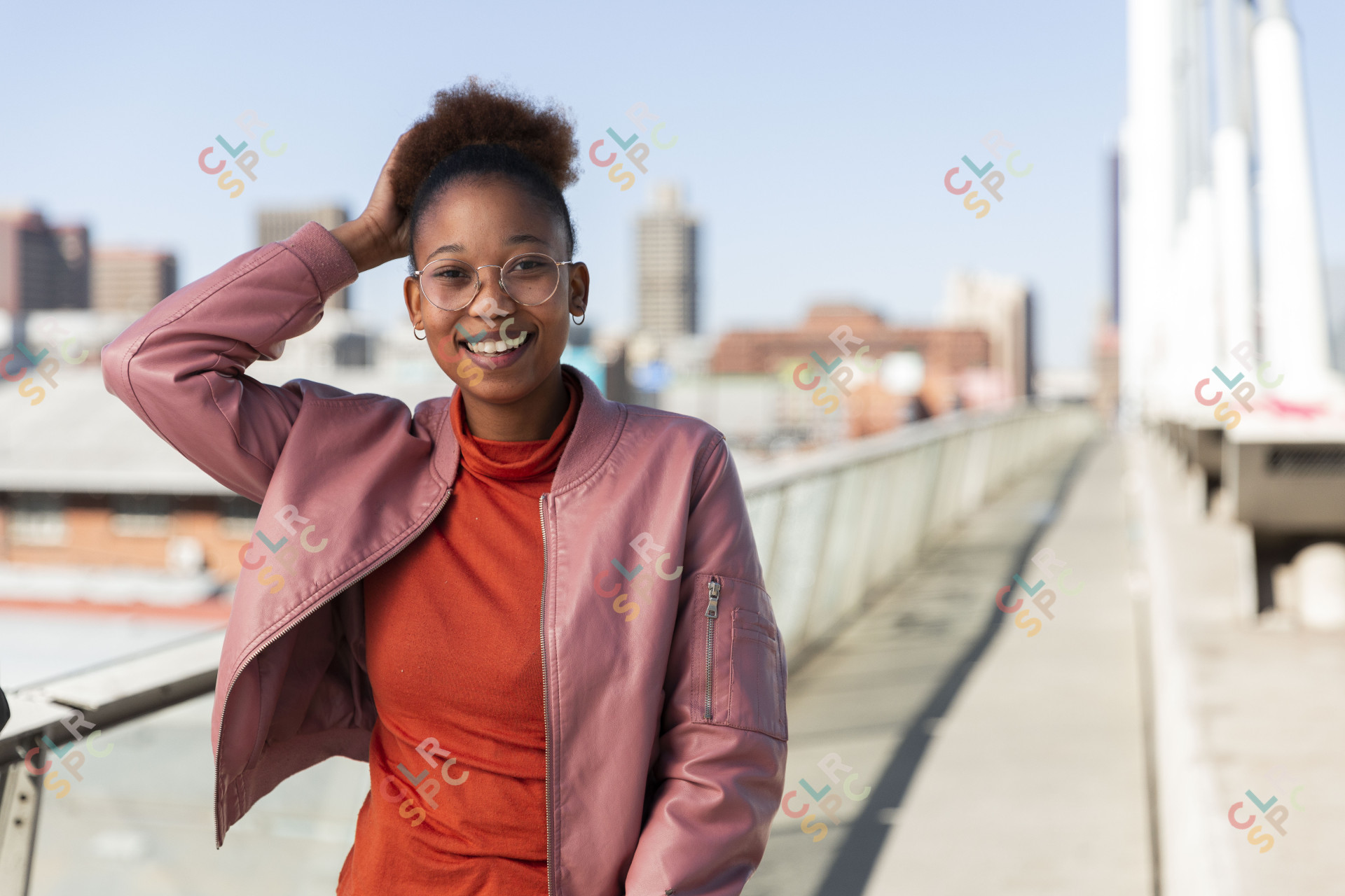 Black woman with afro hair smiling