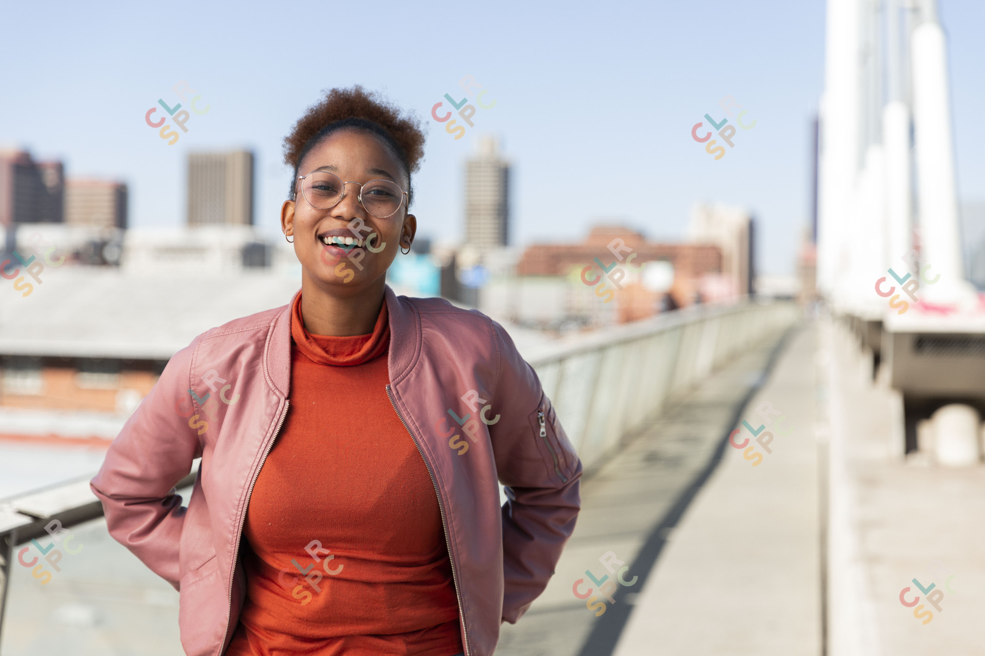 Black woman on Nelson Mandela bridge smiling
