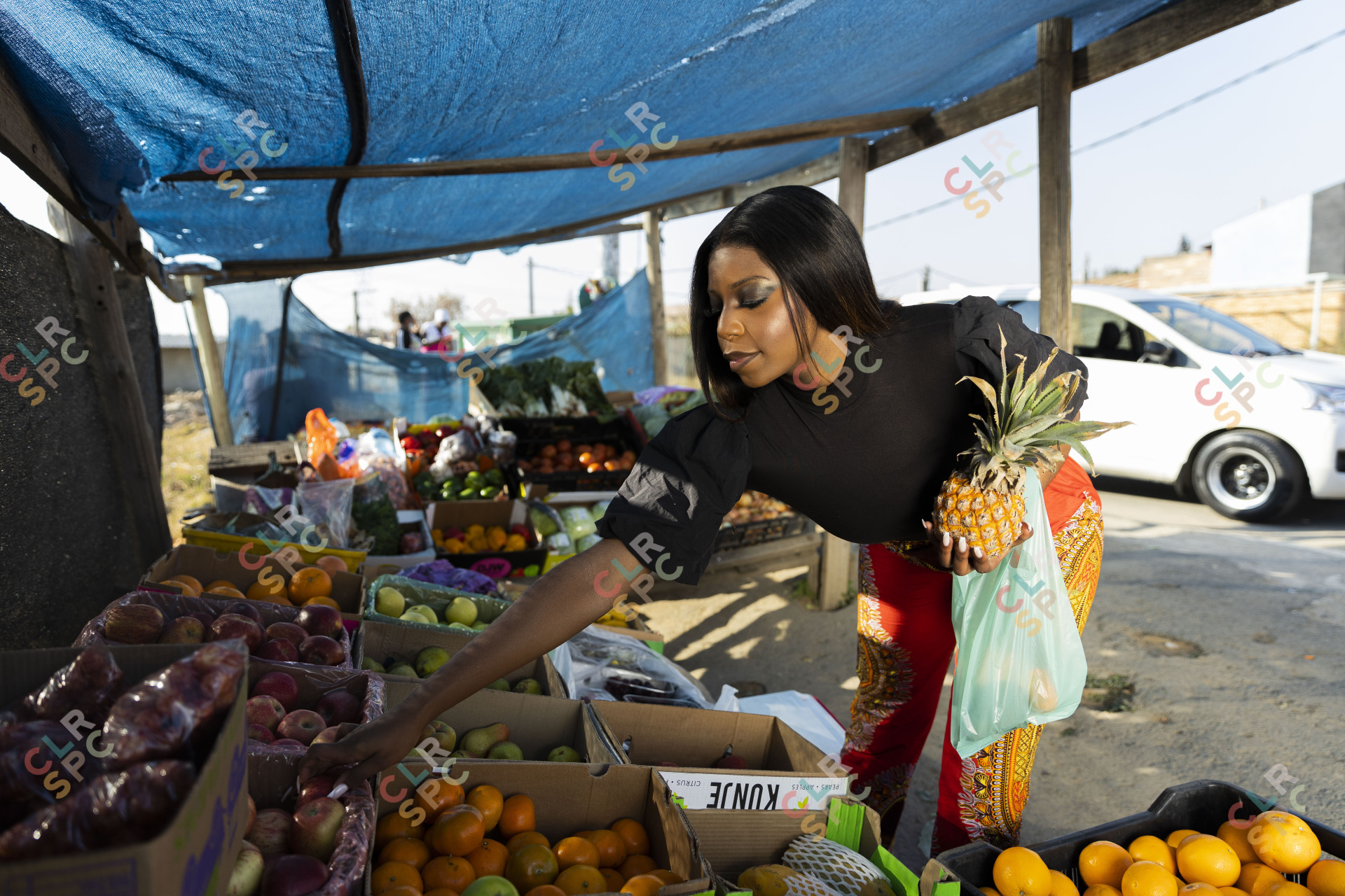 Black woman at the fruit market shopping