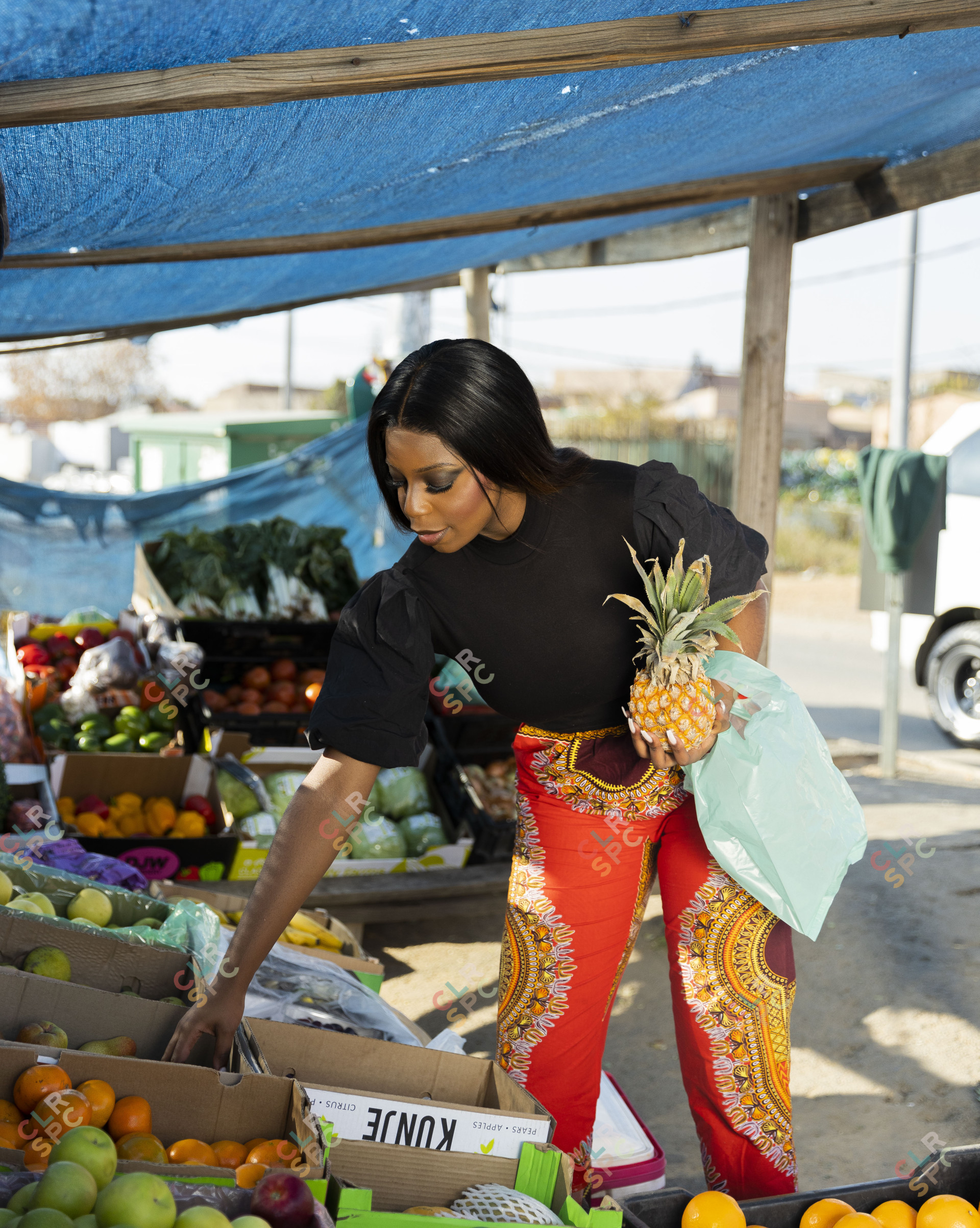 Black woman buying fruits