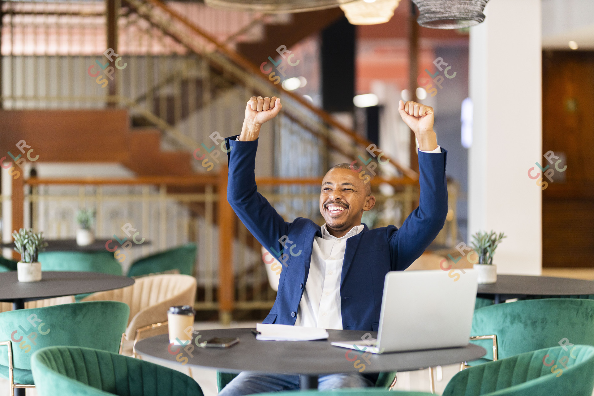 Black business man at work celebrating
