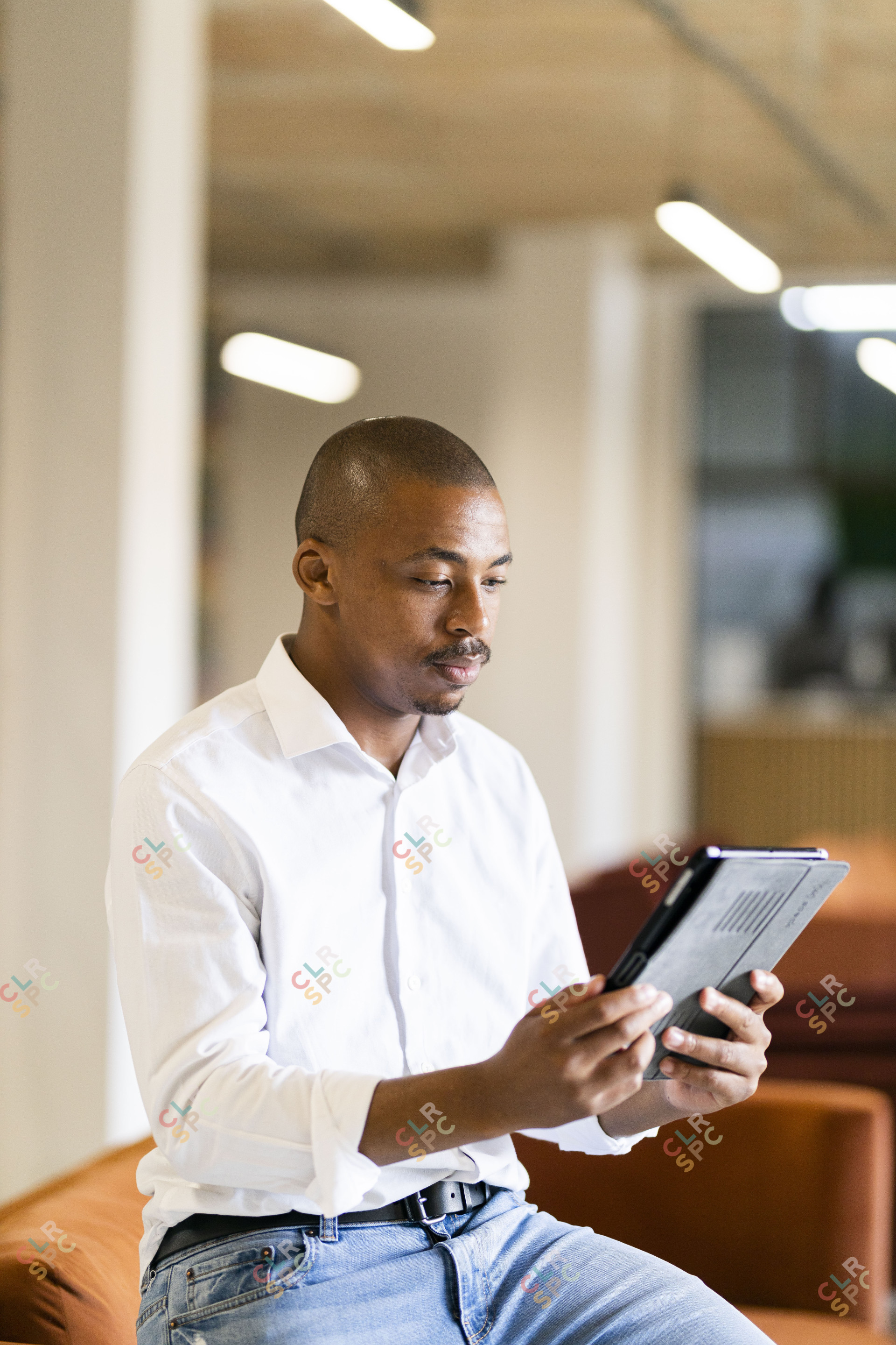 Black man looking at ipad