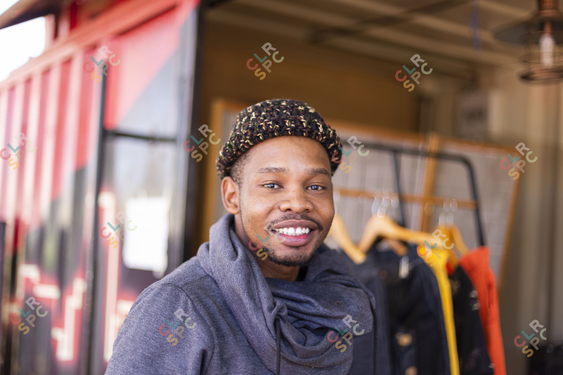 Black man smiling with beanie