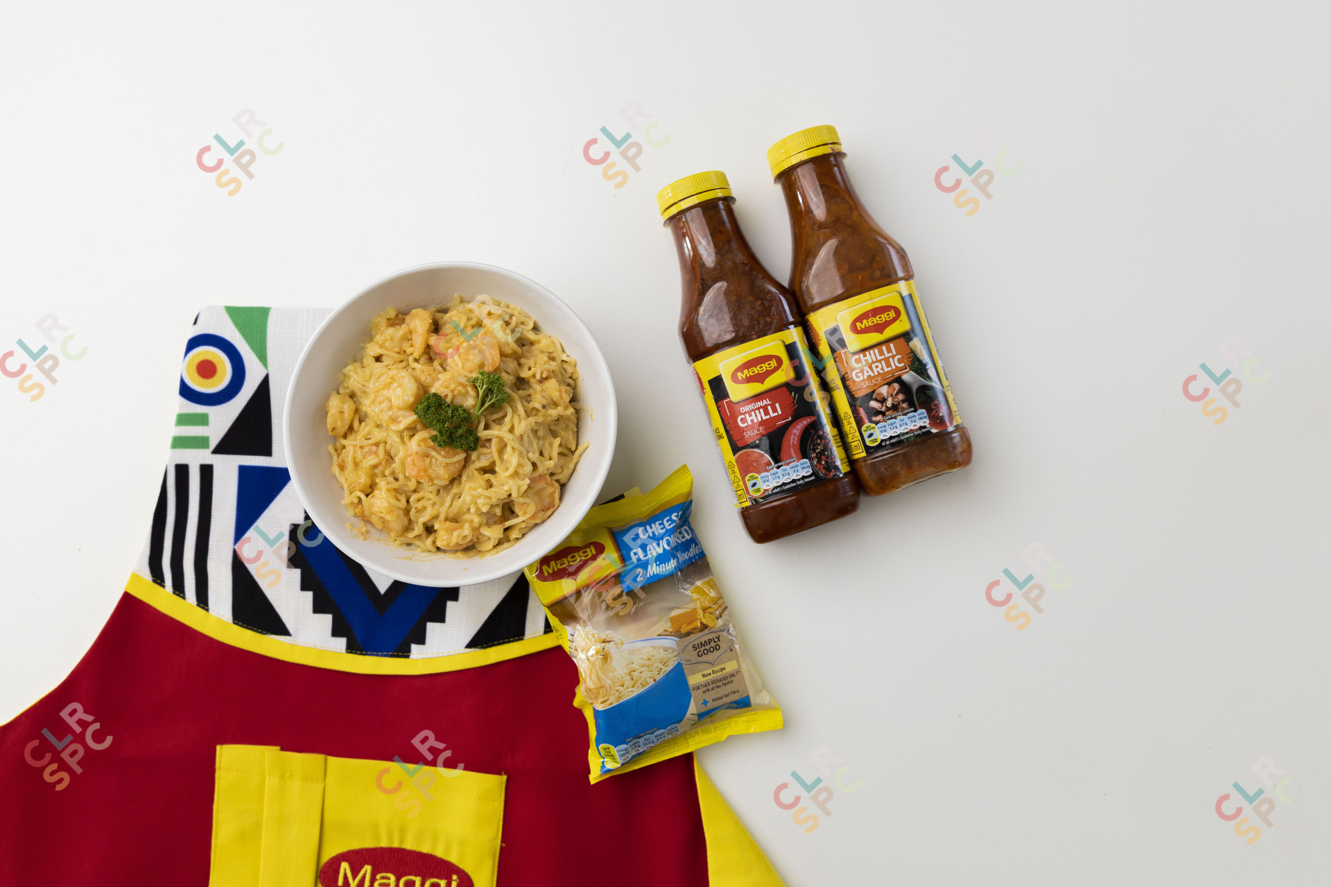 Maggi noodles in a bowl which chilli sauce.