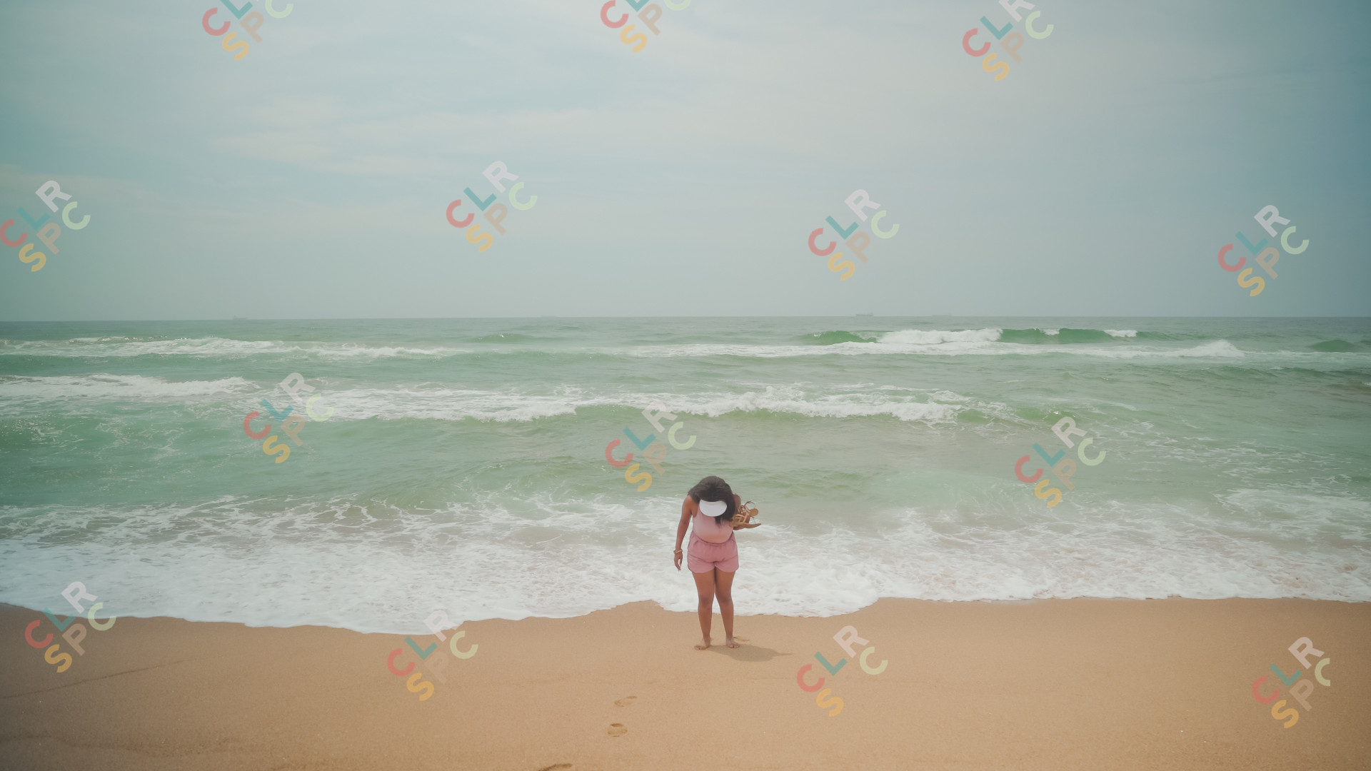 Black woman at Umhlanga beach enjoying the water