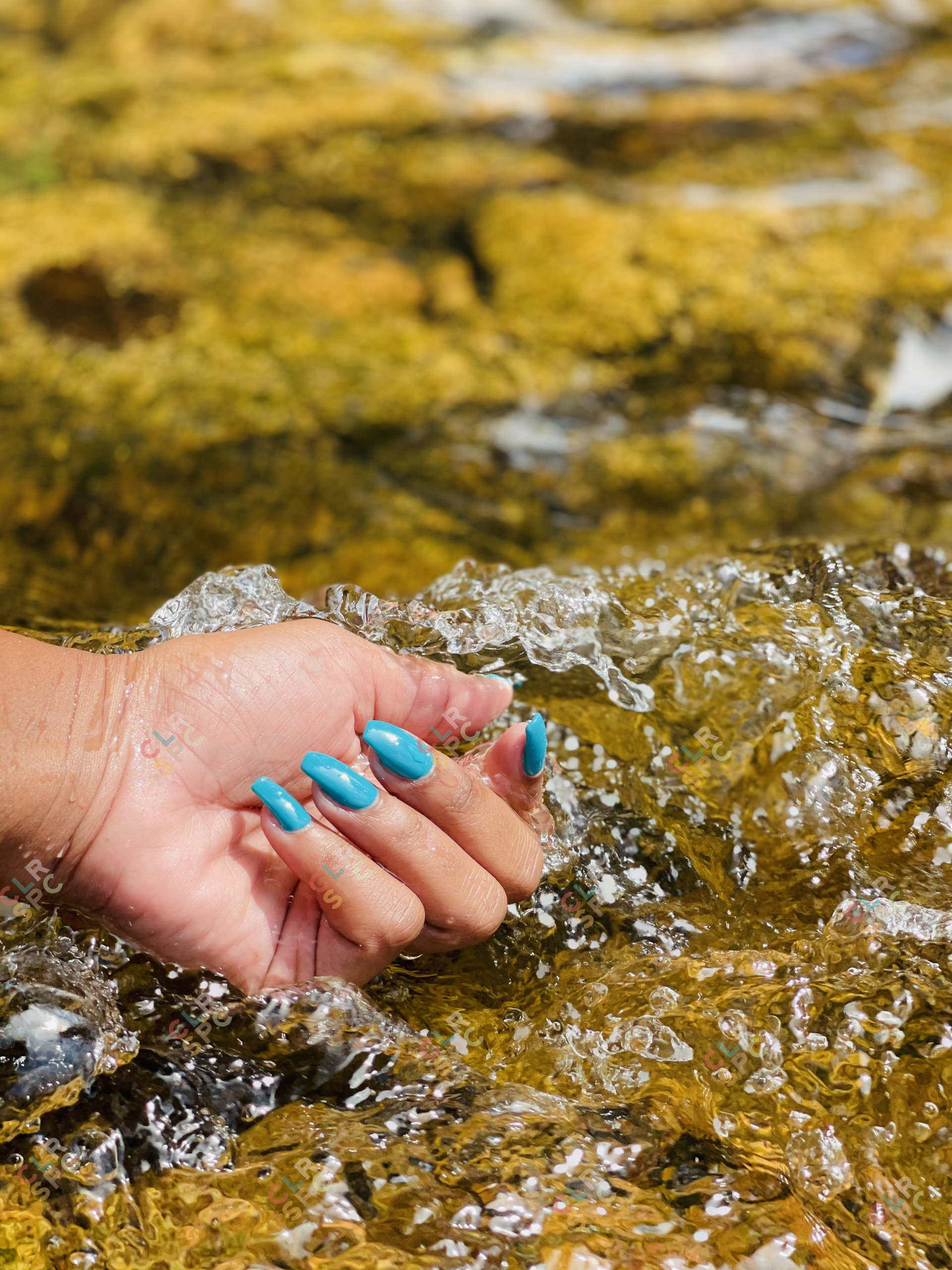 Colourful nails by a river