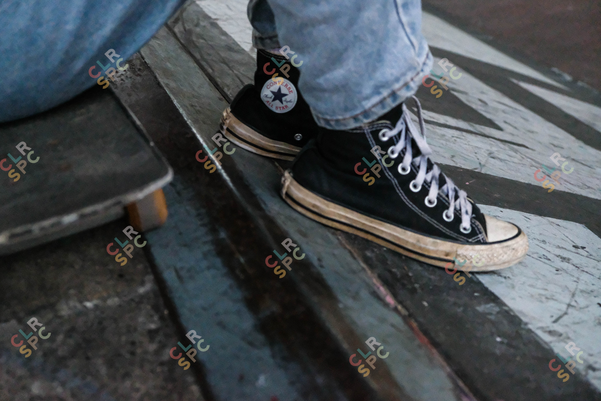 Skateboarder girl wearing converse shoes at the park in Cape Town