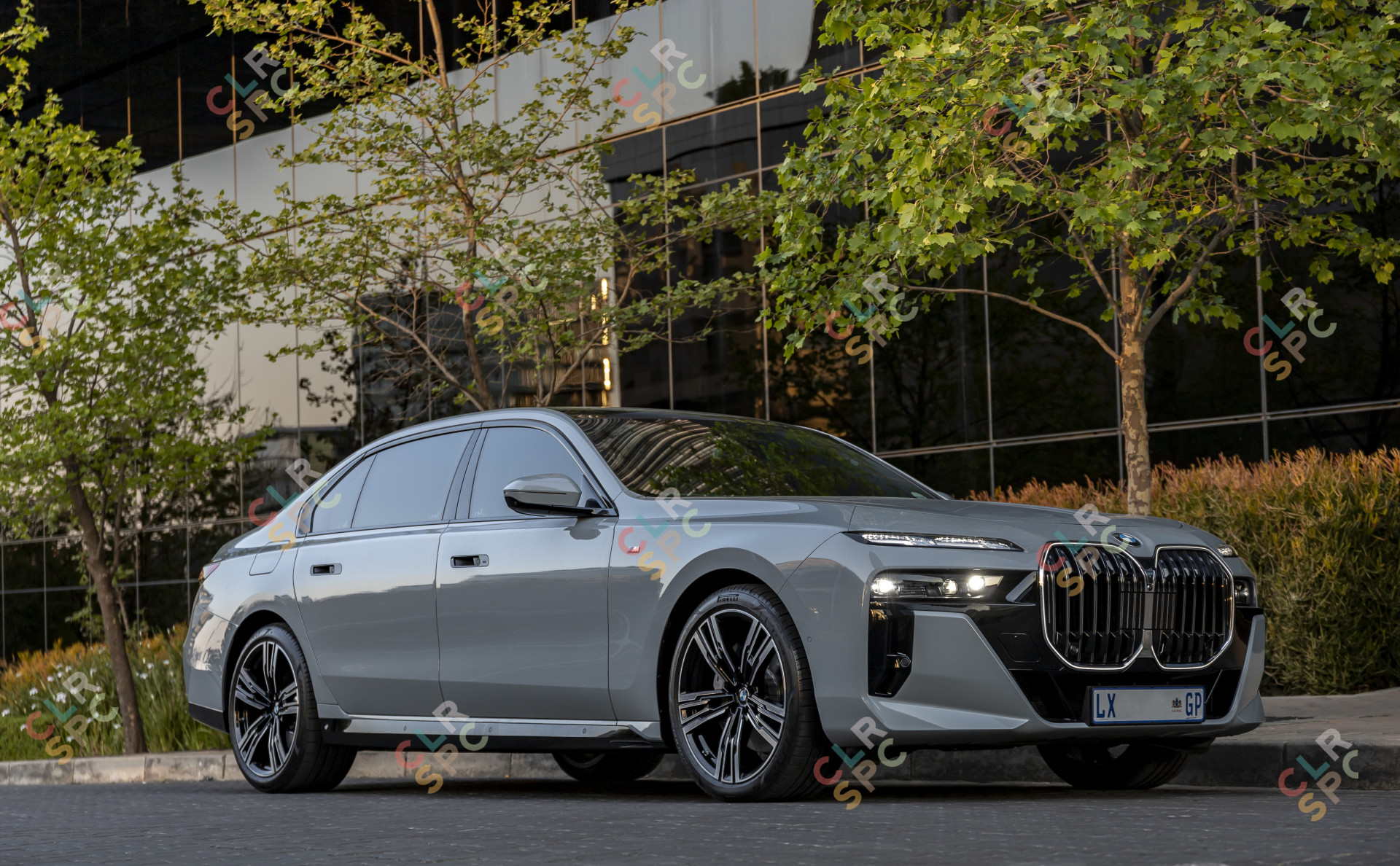BMW i740i car parked near a building