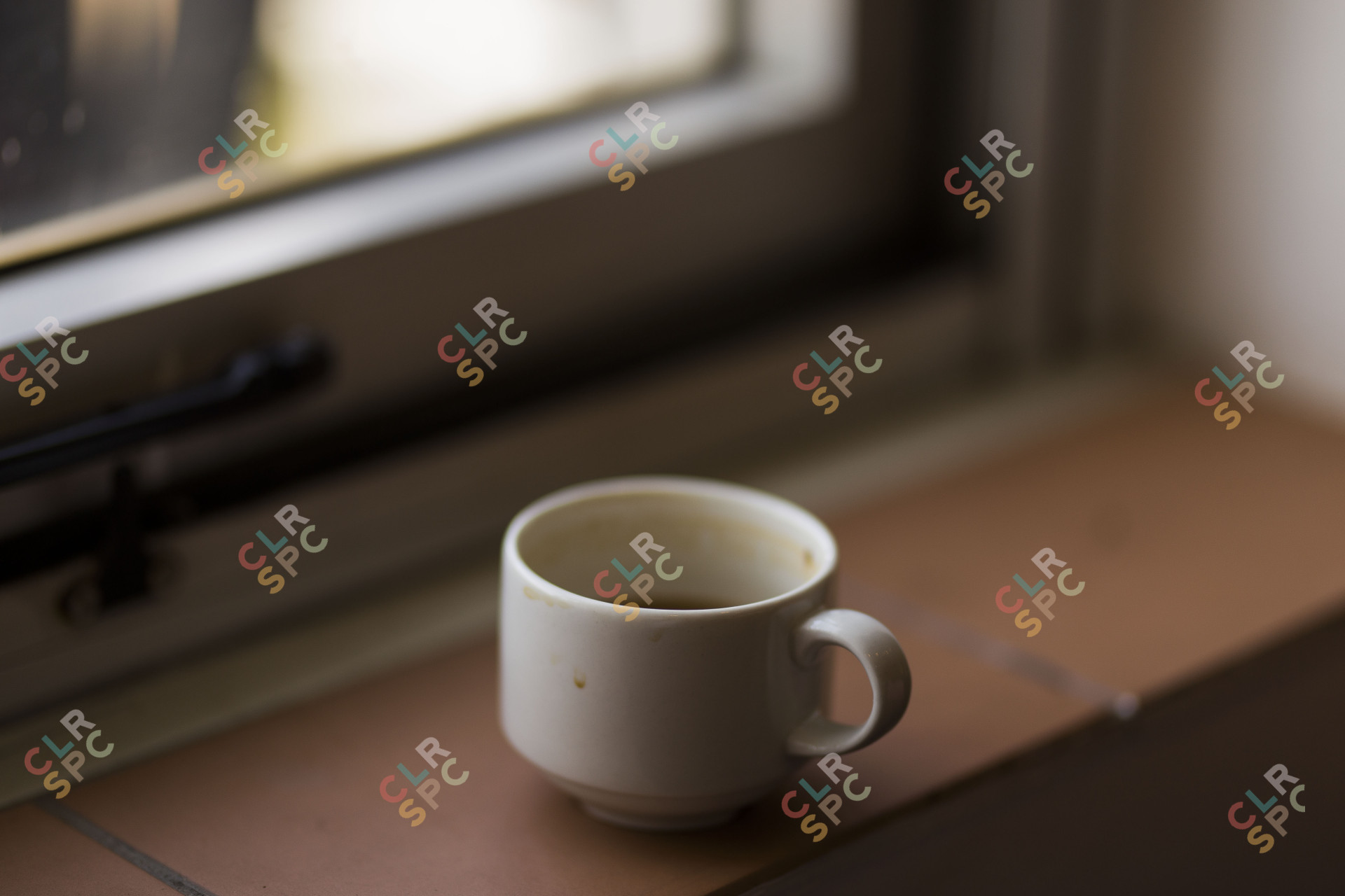 Coffee mug by a window