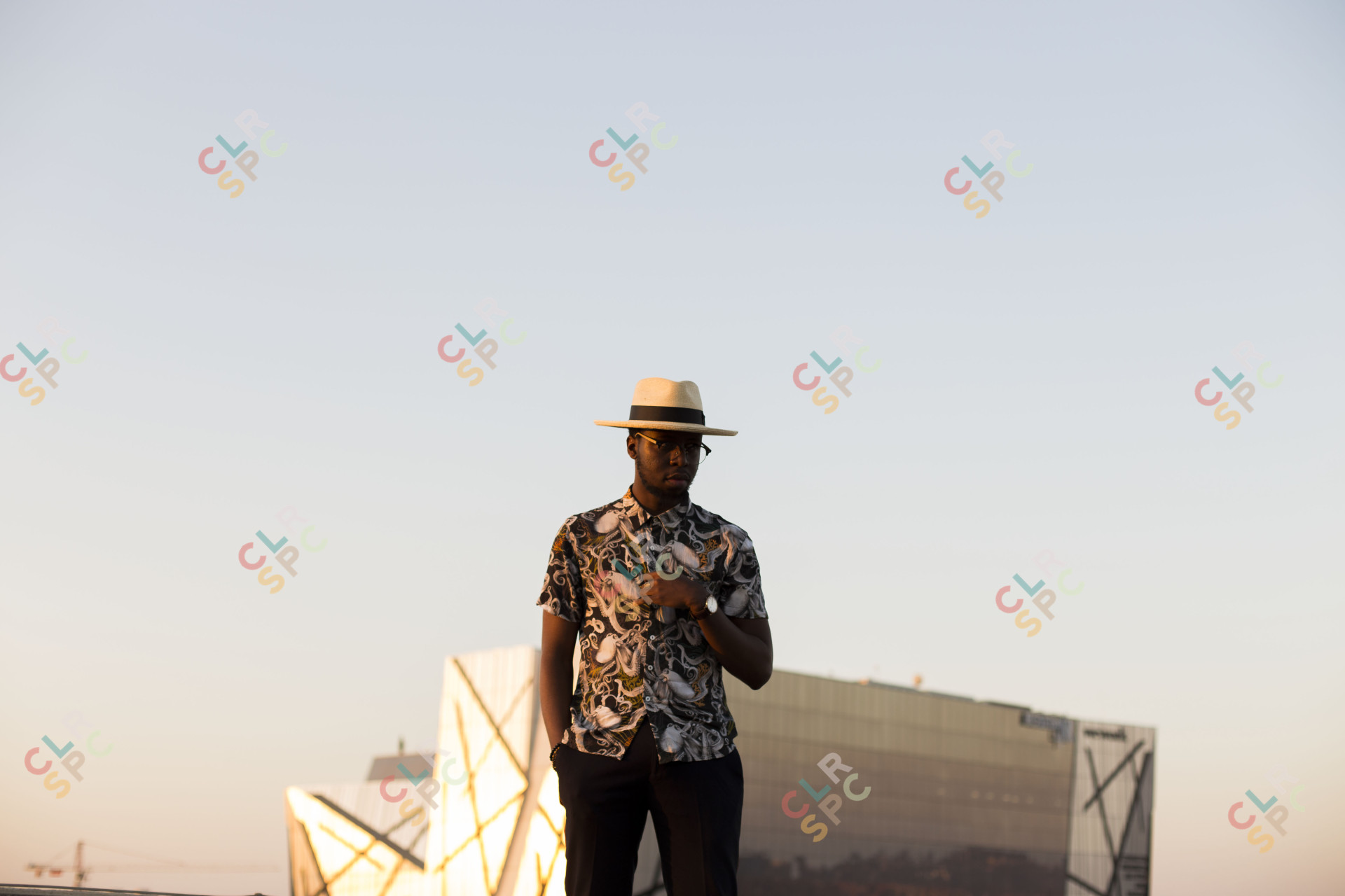 Black man posing on a rooftop
