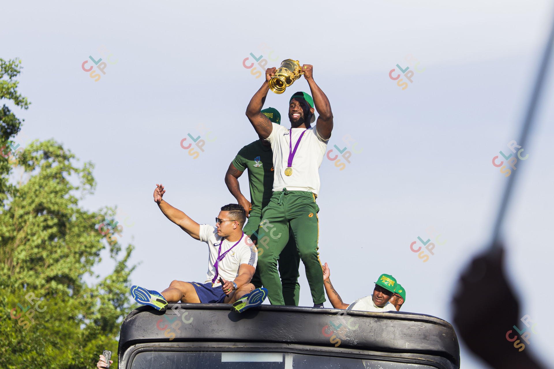 Siya Kholisi holding the Rugby World Cup trophy