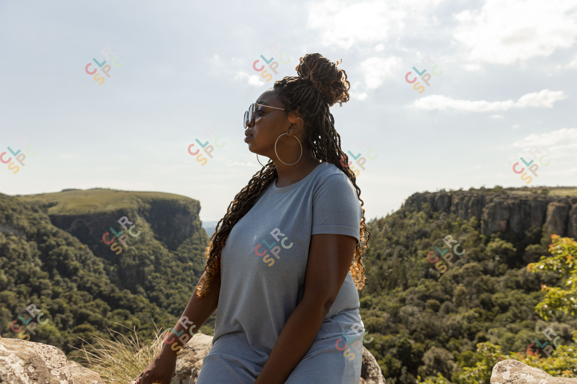 Black woman watching the views of Mpumalanga