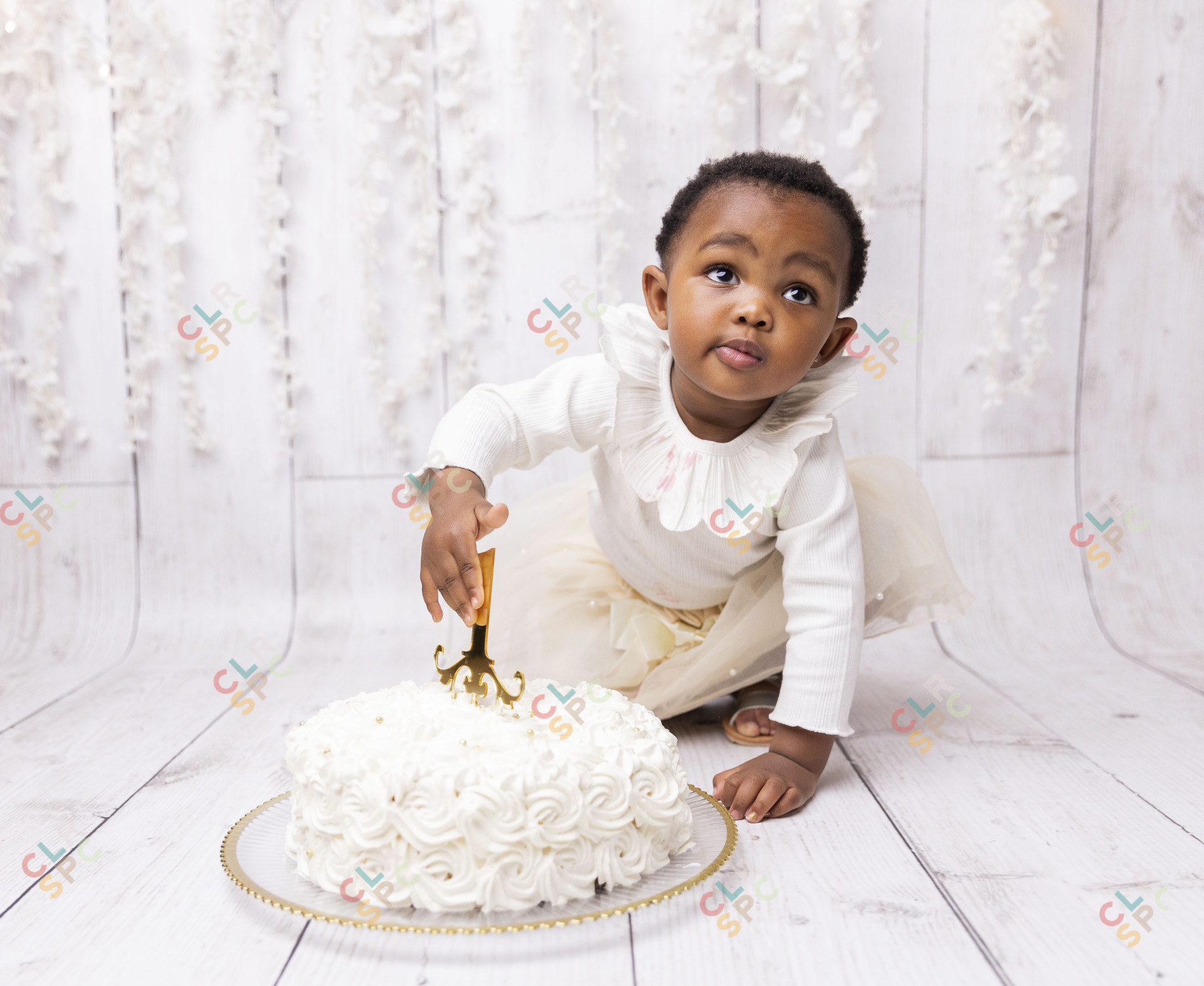Black child playing with cake