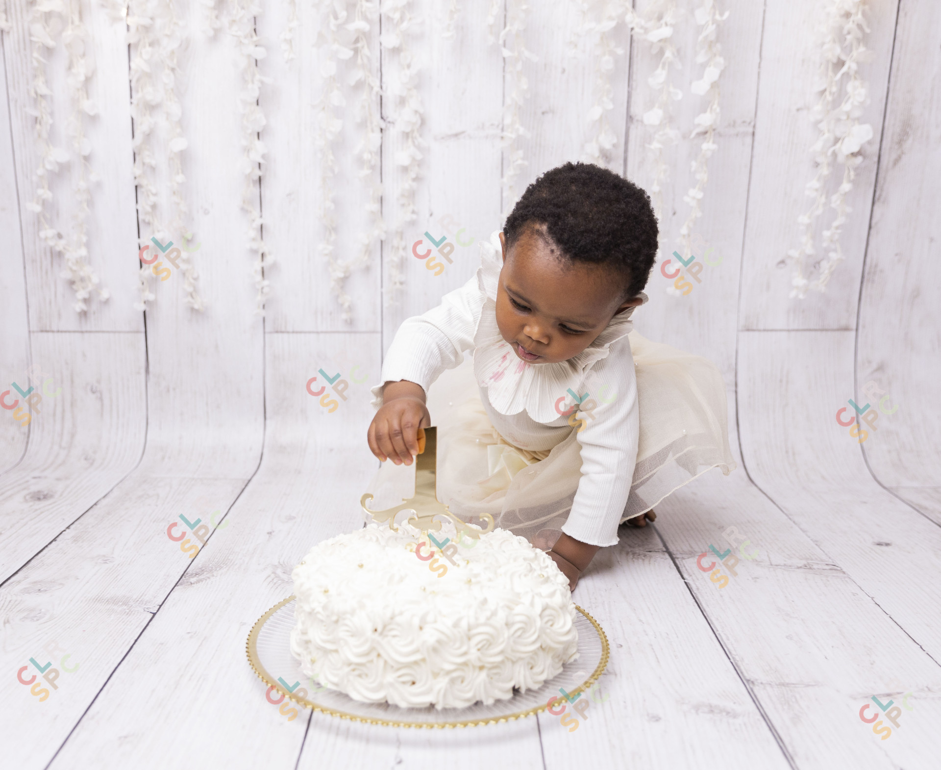 Black child playing with cake