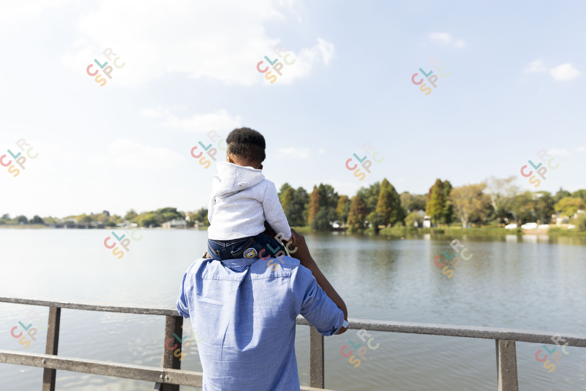 Father and son by the dam