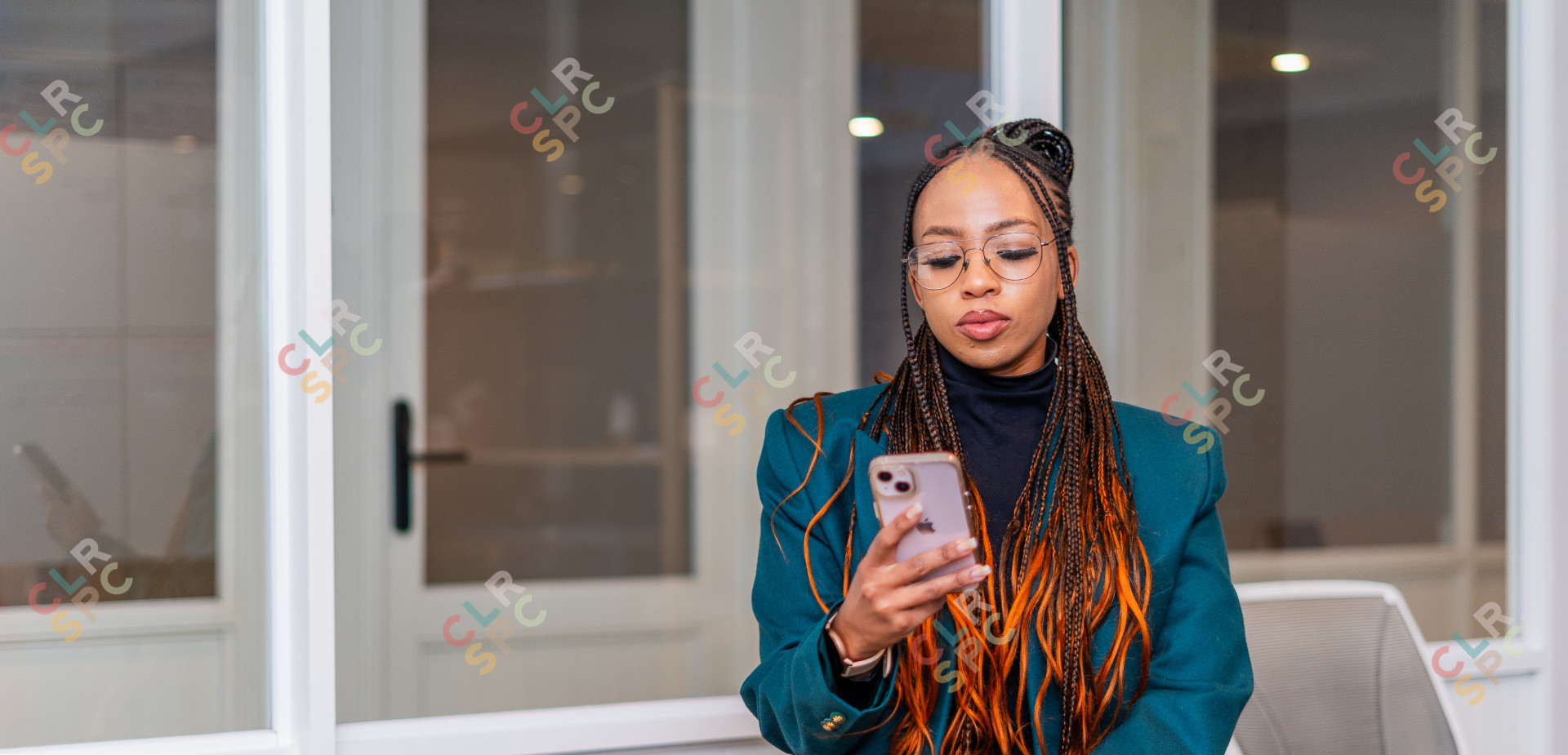 Black woman looking at phone