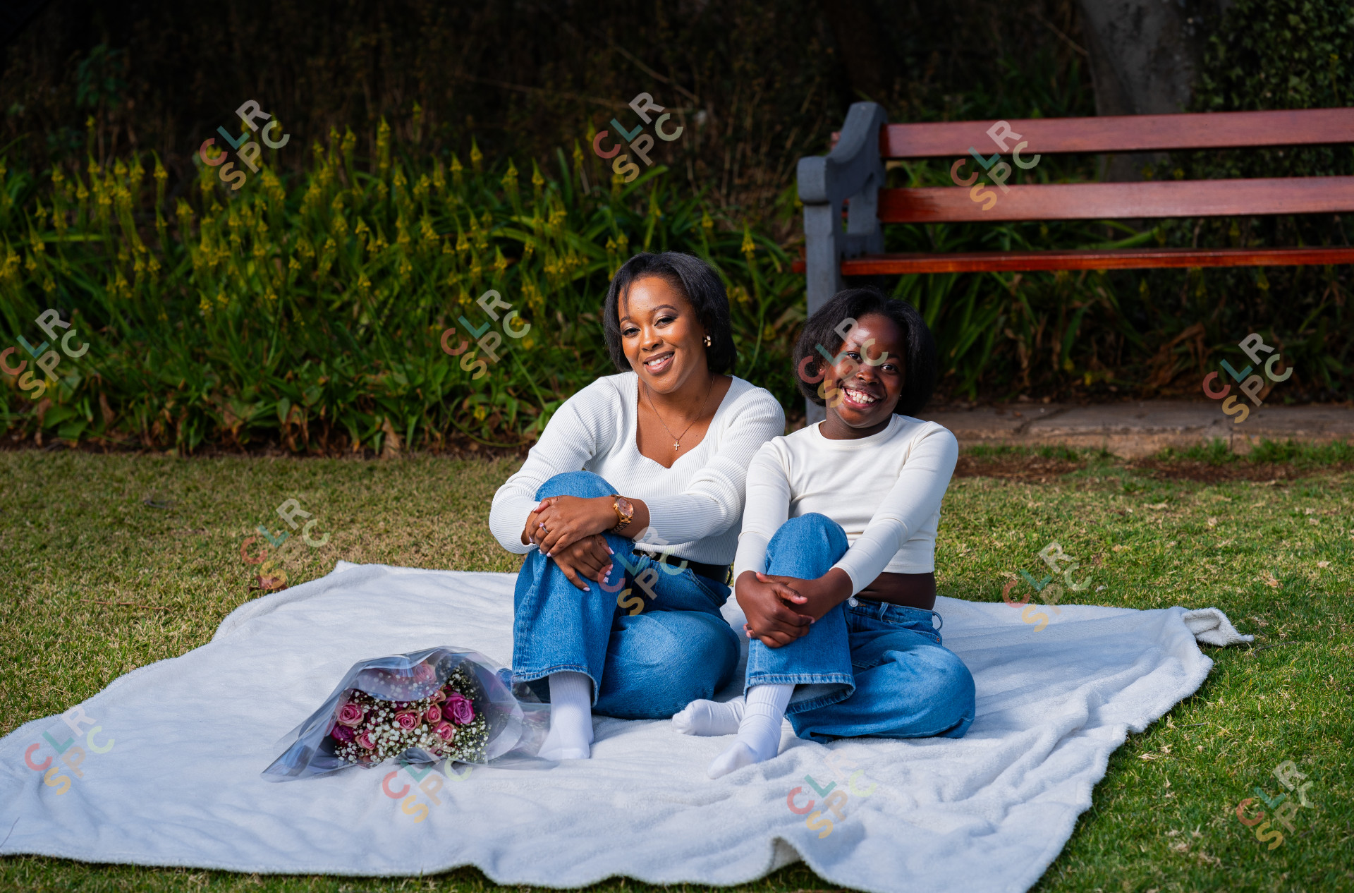 Happy African mother enjoying an afternoon at the park with her daughter