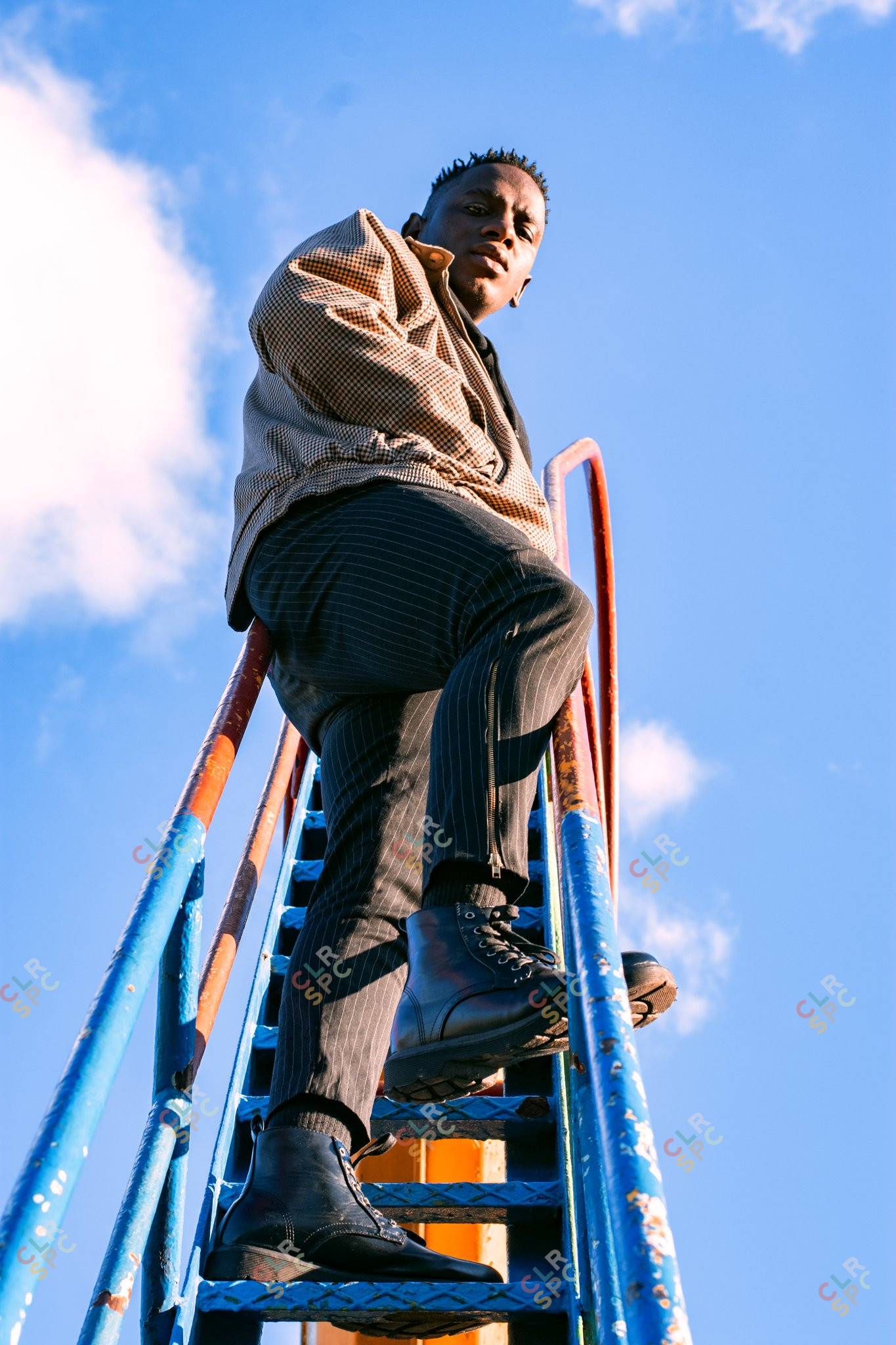 Man on a park slide